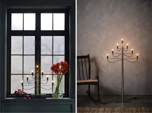 Två adventsljusstake inspirationer: en i ett mörkt fönster med amaryllis och äpplen, en annan som golvlampa bredvid en gungstol.